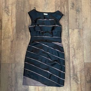 Black and bronze mark bandage strap sheath dress.
